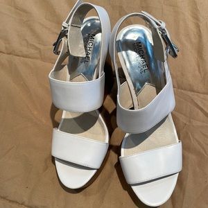 Brand new, never used. Michael Kors sandal wedges.
